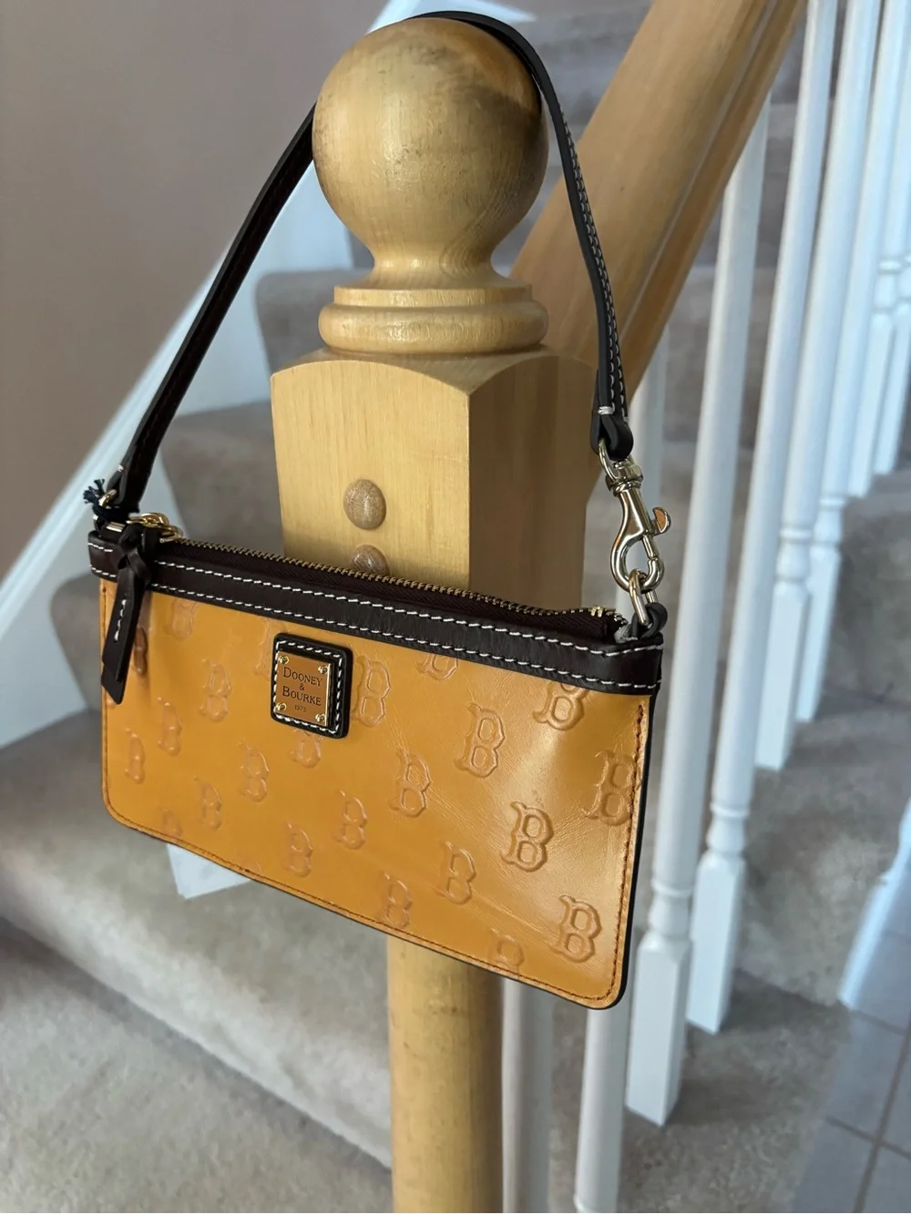 Dooney & Bourke Mustard Yellow Logo-Embossed Wristlet with Brown Trim